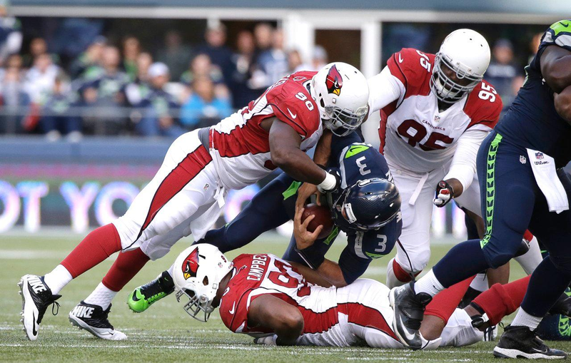 Arizona defensive end Frostee Rucker tackles Seattle quarterback Russell Wilson during the teams’ first meeting this season. (Photo: Arizona Cardinals)